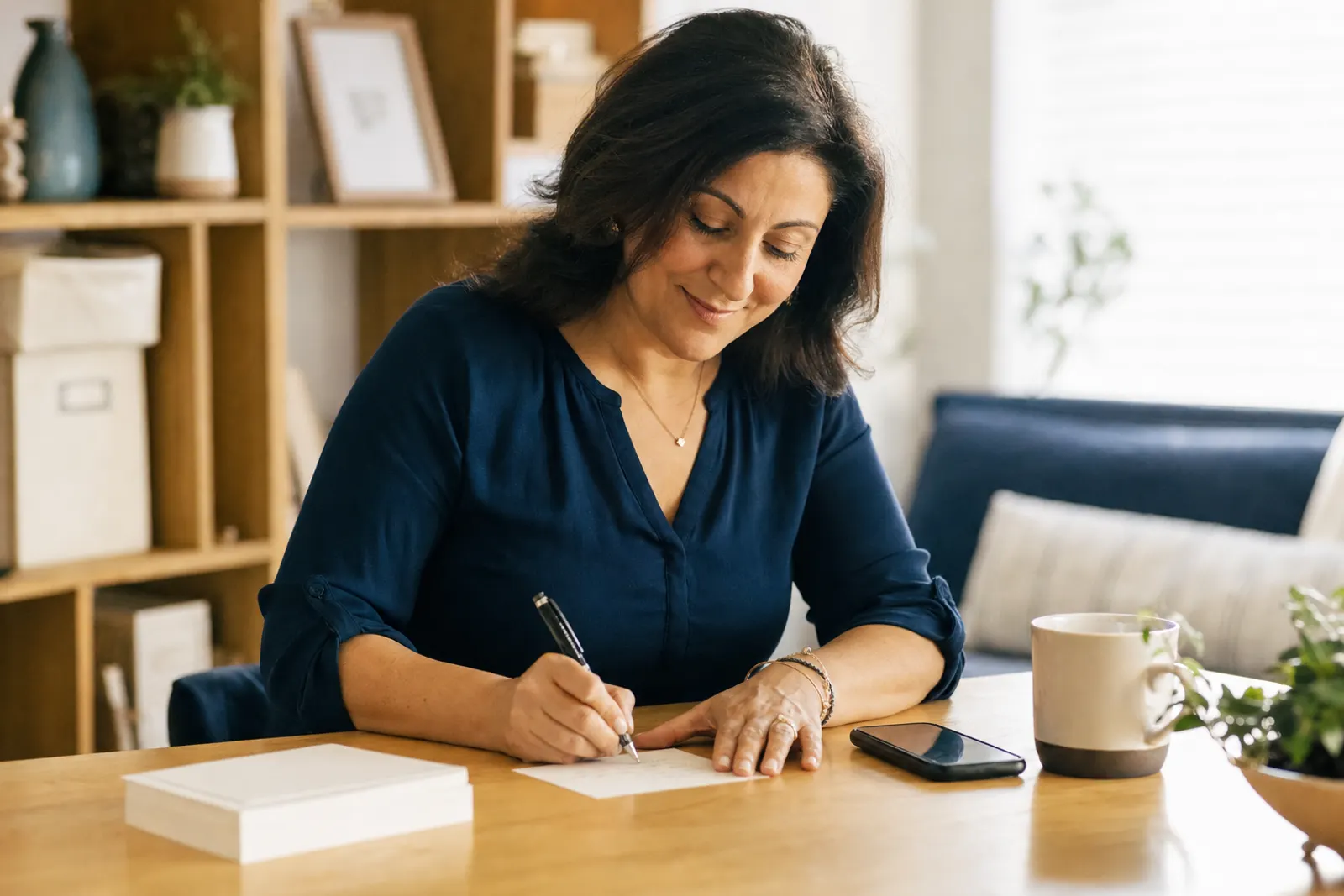 A connect leader writes a note card on Monday morning.