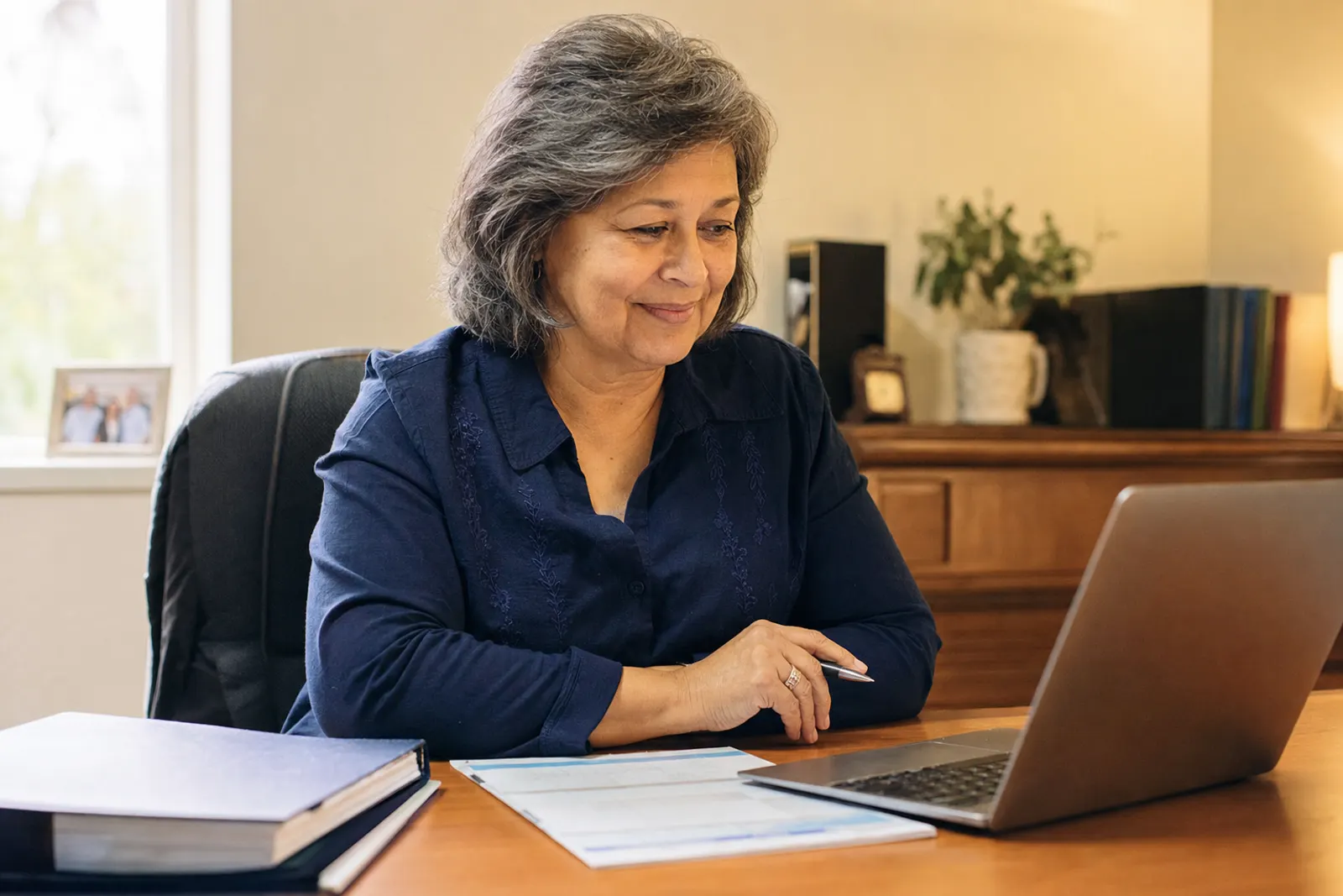 A bookkeeper reviews the deposit midweek.